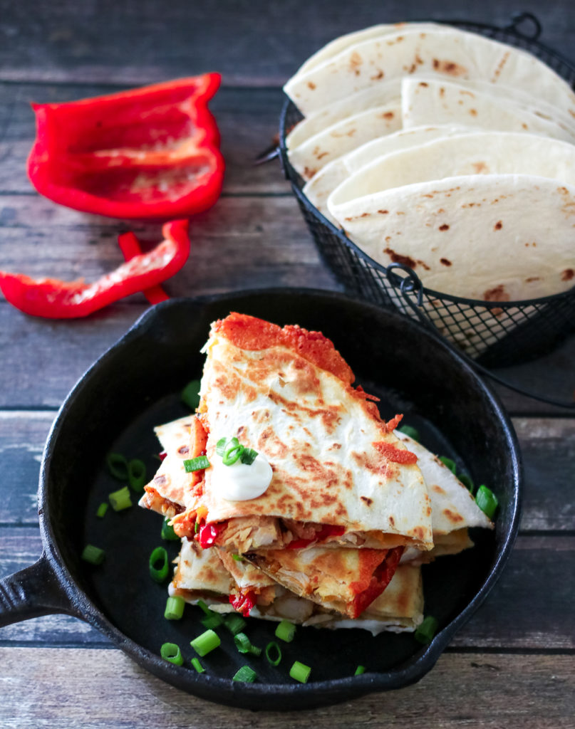 Chicken Fajita Quesadillas are a cheesy spin on a classic. Full of fajita veggies, tender chicken and lots of cheese these are perfect any night!