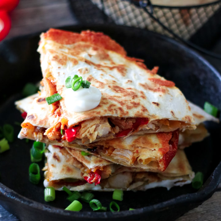 Chicken Fajita Quesadillas are a cheesy spin on a classic. Full of fajita veggies, tender chicken and lots of cheese these are perfect any night!