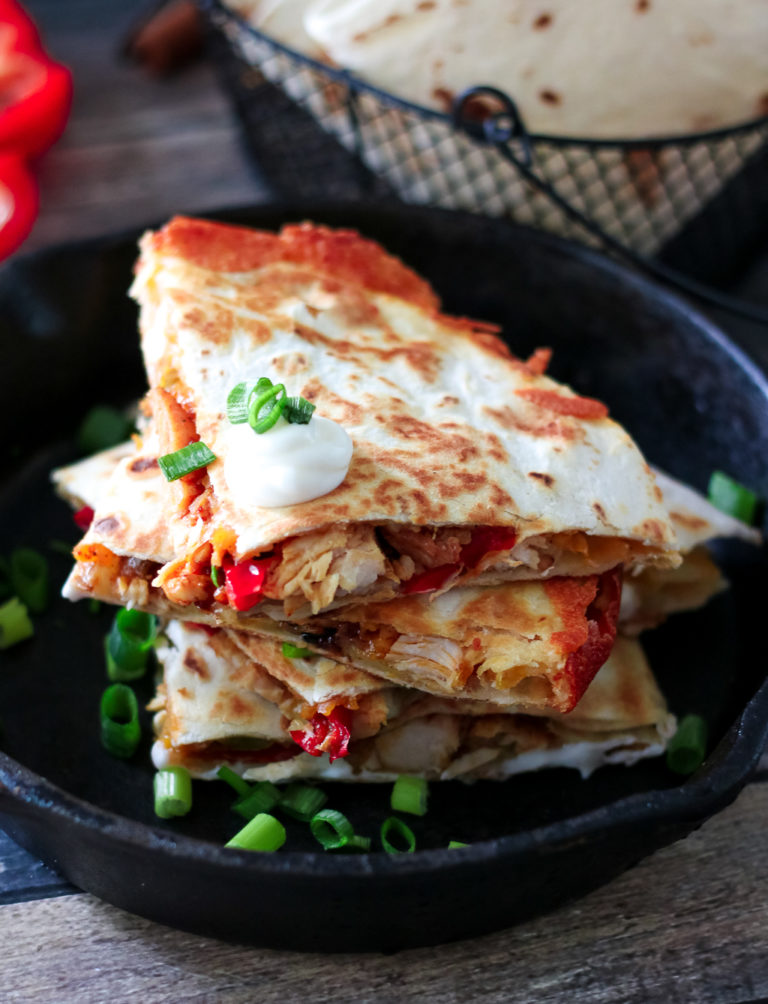 Chicken Fajita Quesadillas are a cheesy spin on a classic. Full of fajita veggies, tender chicken and lots of cheese these are perfect any night!