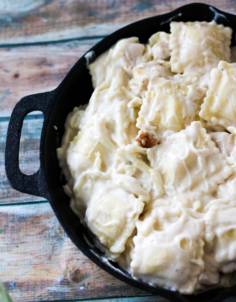 Chicken Alfredo Ravioli Bake is a cheesy crowd-pleasing dinner that has only 4 ingredients! Takes just minutes to get on the table!