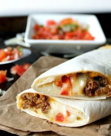 Copycat Meximelts are a drive thru favorite you can make at home! Melty cheese, flavorful beef and pico make these a family favorite!
