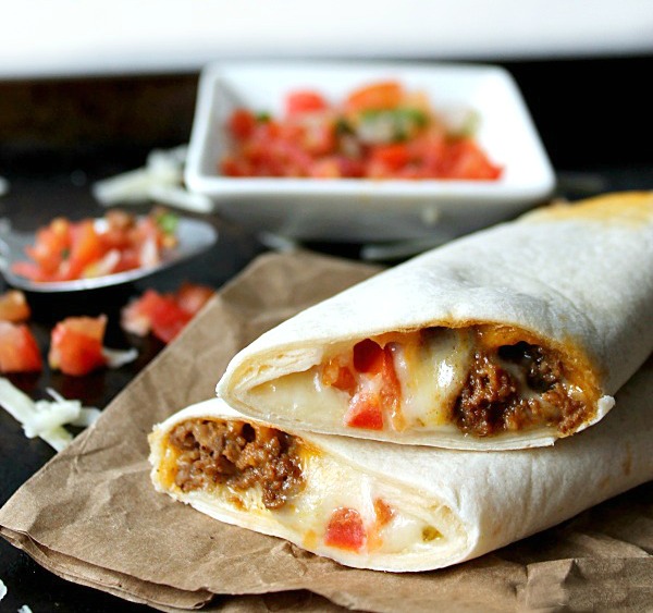 Copycat Meximelts are a drive thru favorite you can make at home! Melty cheese, flavorful beef and pico make these a family favorite!