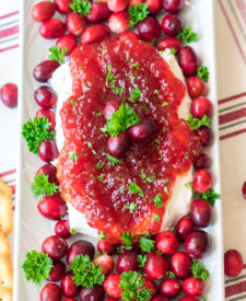 Cranberry Pepper Jelly Dip is just 3 ingredients and everyone's favorite festive appetizer! Comes together in just minutes, perfect for the holidays!