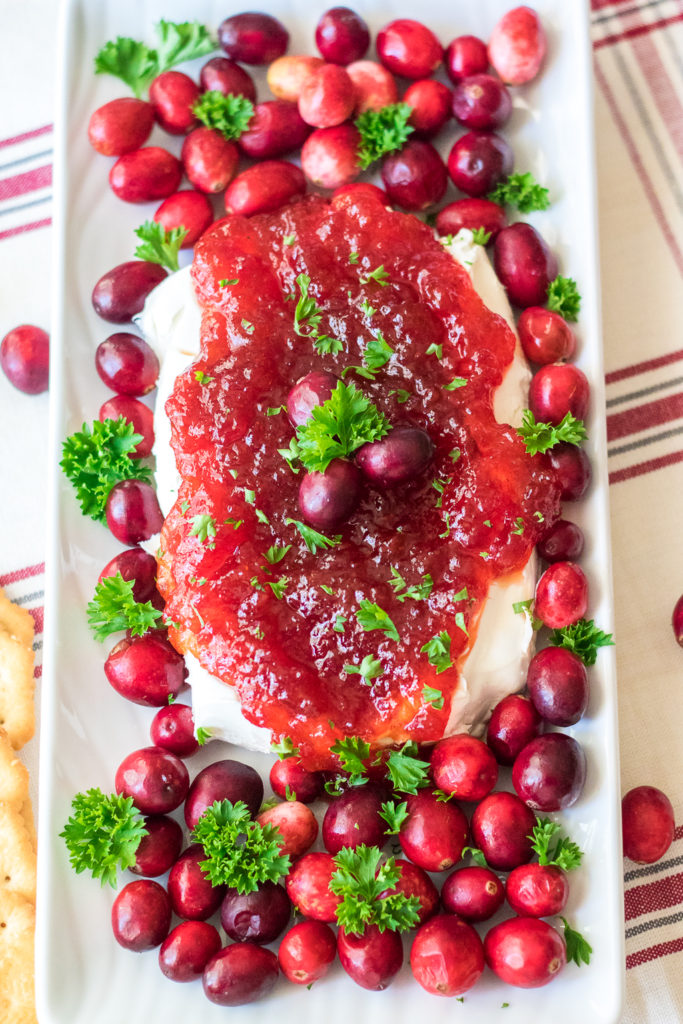 Cranberry Pepper Jelly Dip is just 3 ingredients and everyone's favorite festive appetizer! Comes together in just minutes, perfect for the holidays!