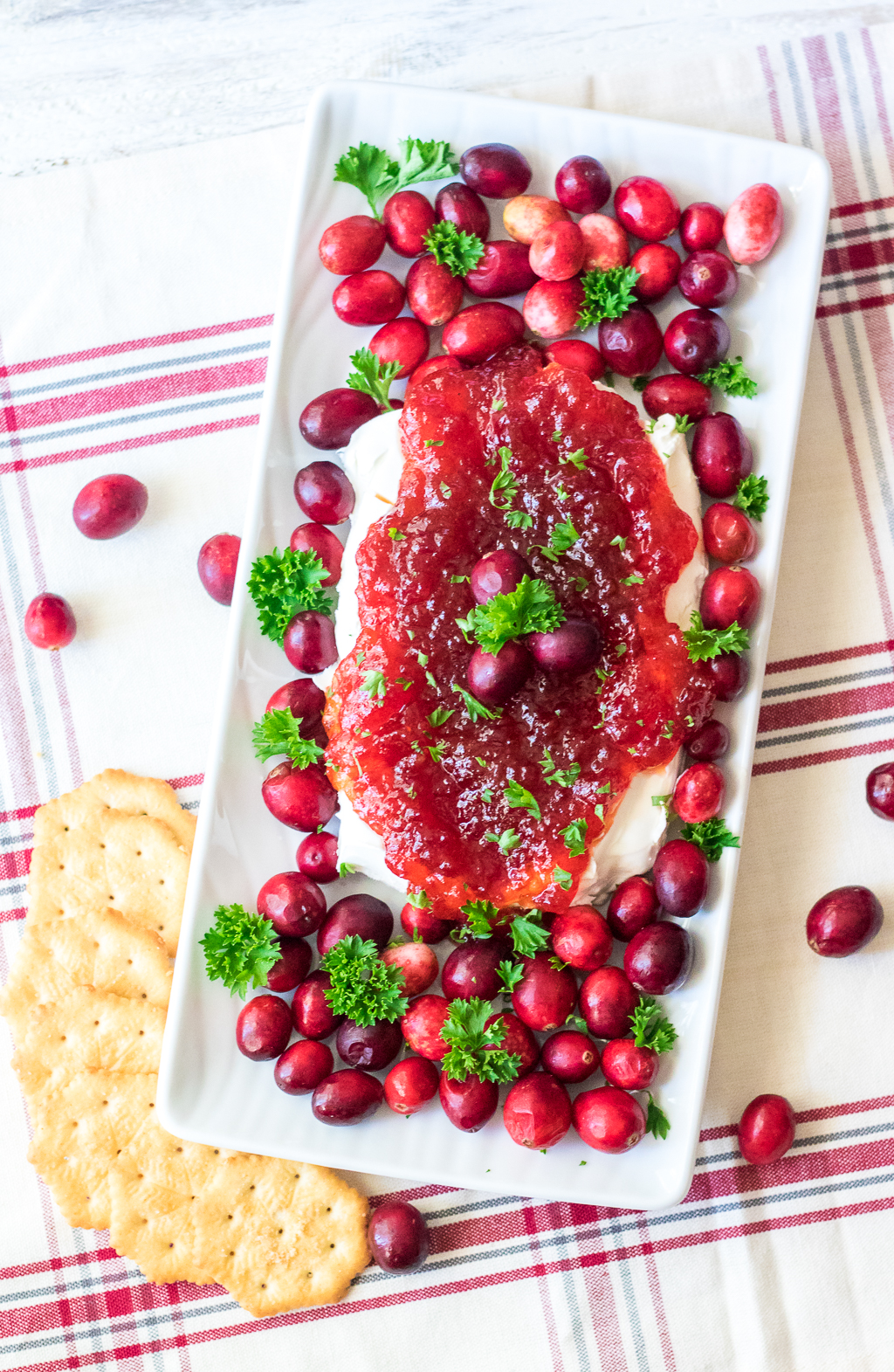 Cranberry Pepper Jelly Dip is just 3 ingredients and everyone's favorite festive appetizer! Comes together in just minutes, perfect for the holidays!
