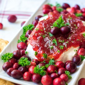 Cranberry Pepper Jelly Dip is just 3 ingredients and everyone's favorite festive appetizer! Comes together in just minutes, perfect for the holidays!