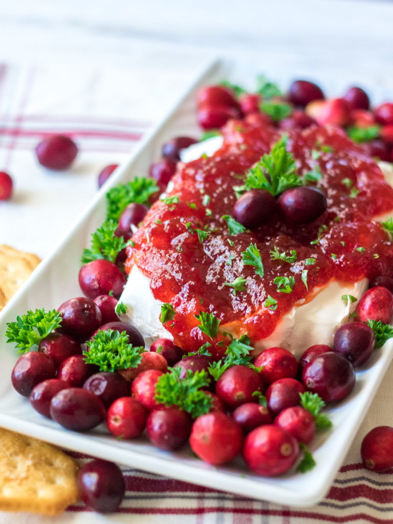 Cranberry Pepper Jelly Dip is just 3 ingredients and everyone's favorite festive appetizer! Comes together in just minutes, perfect for the holidays!