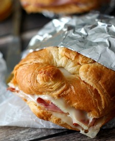 Hot Ham & Swiss Croissants, buttery croissants, melty cheese and a honey mustard sauce all melt together to make the perfect sandwich.