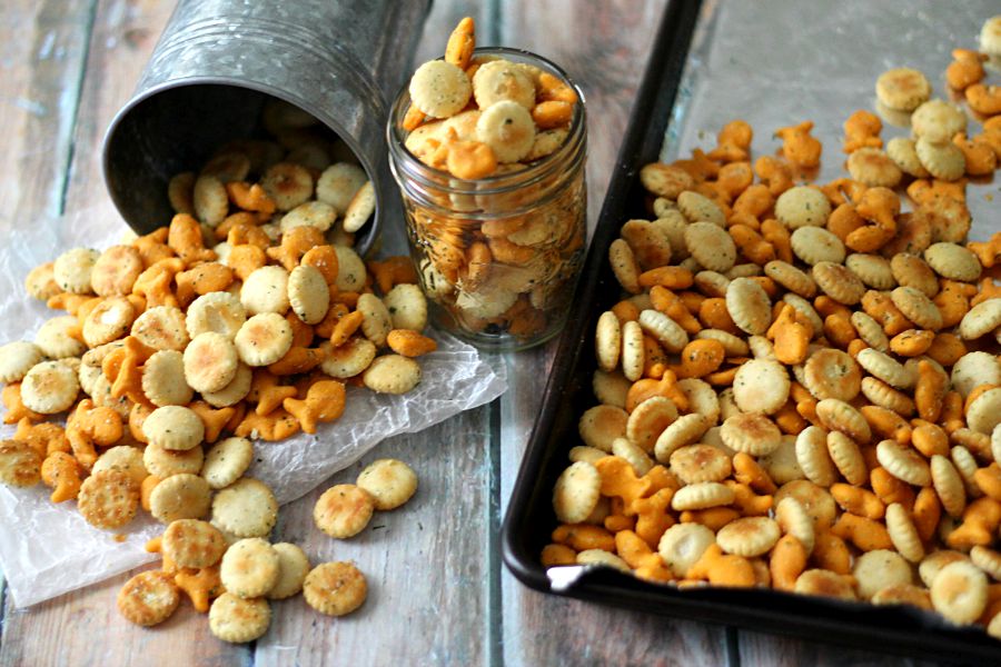 Easy Ranch Snack Mix; bite-sized crackers and cheesy goldfish all tossed in a ranch coating and toasted, it is snacking perfection made in minutes!