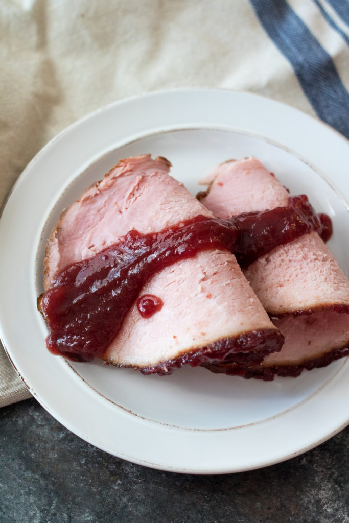 Cola Cranberry Glazed Ham is a new twist on a traditional family recipe using Coca Cola and sure to be your new favorite!