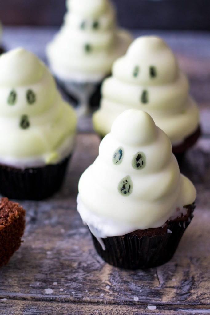 Ghost Hi Hat Cupcakes have a fun surprise inside!! Bite into the spooky ghosts to reveal a green marshmallow frosting inside! So much fun!