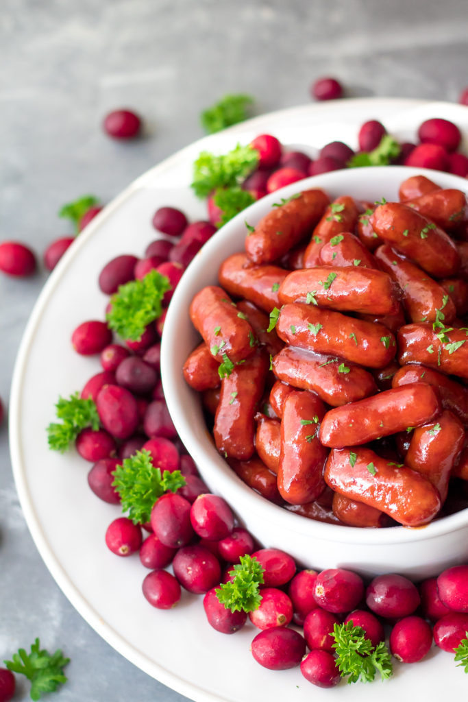 Slow Cooker Cranberry BBQ Little Smokies are the perfect holiday appetizer! Just 4 ingredients in the slow cooker to make this festive delicious dish!