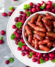 Slow Cooker Cranberry BBQ Little Smokies are the perfect holiday appetizer! Just 4 ingredients in the slow cooker to make this festive delicious dish!