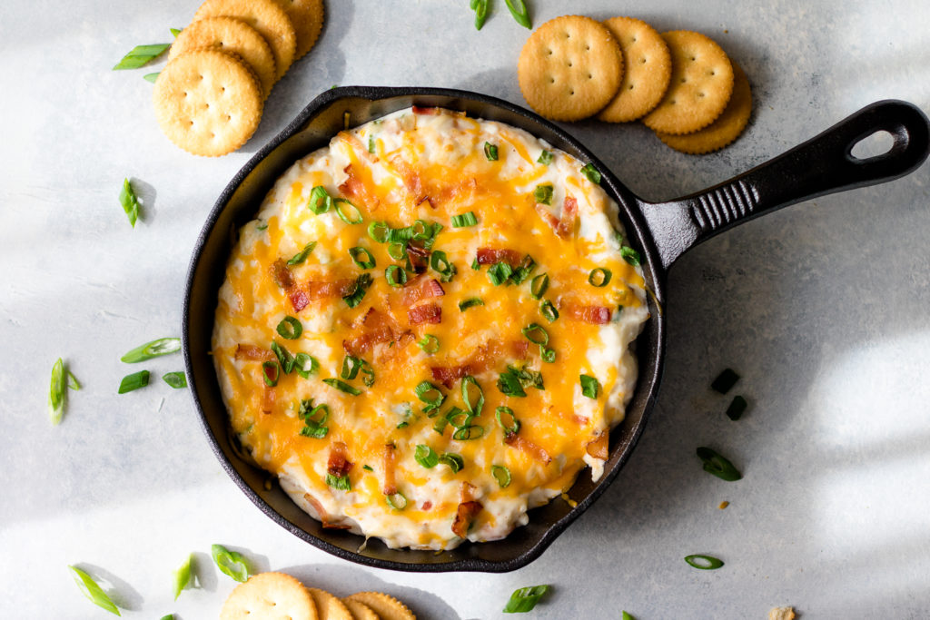 Loaded Baked Potato Dip is a deliciously easy way to get all your favorite flavors of potato skins in one amazingly cheesy dip!