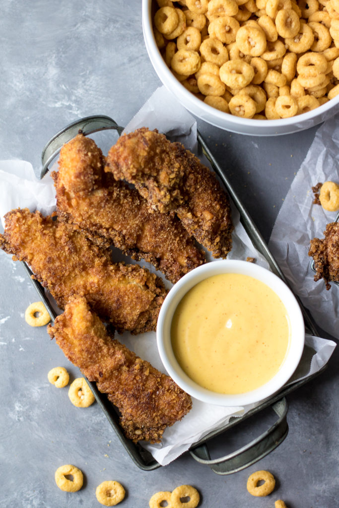 Honey Crunch Chicken Strips are the perfect weeknight dinner! Sweet honey crunch coating goes perfectly with honey mustard dipping sauce, yum!