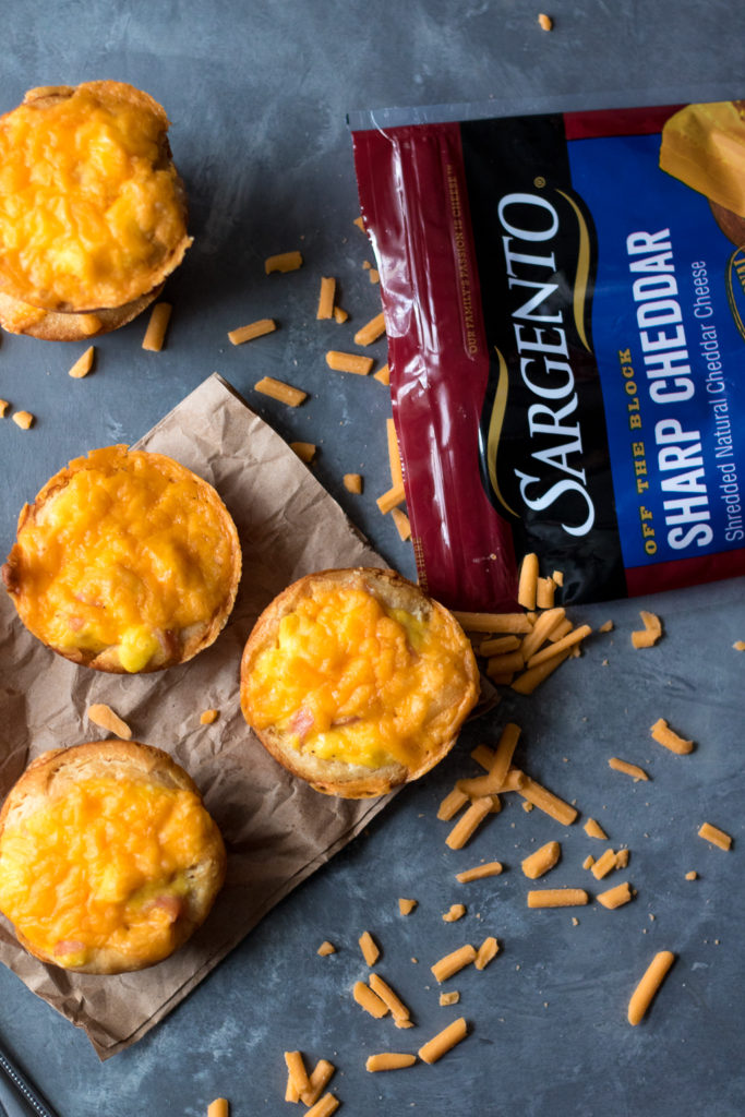 Cheesy Ham & Egg Biscuit Cups are an easy and delicious breakfast. Egg, cheese and ham all baked up in a biscuit cup is breakfast perfection!