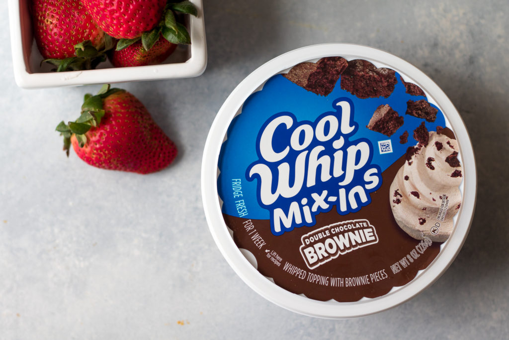 Double Brownie Stuffed Strawberries are the easy 2 ingredient snack or dessert you can whip up in minutes!! Double Brownie Cool-Whip makes these delicious!