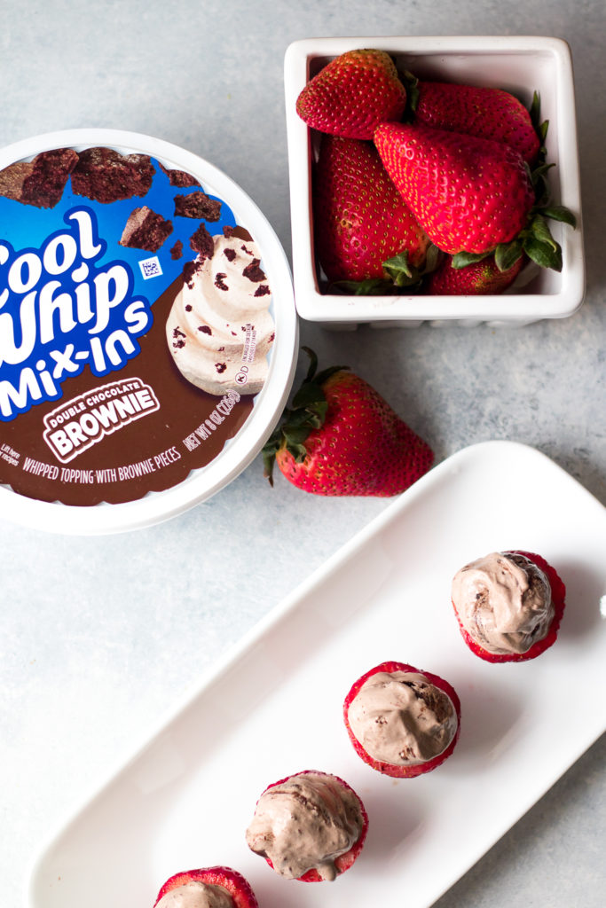 Double Brownie Stuffed Strawberries are the easy 2 ingredient snack or dessert you can whip up in minutes!! Double Brownie Cool-Whip makes these delicious!