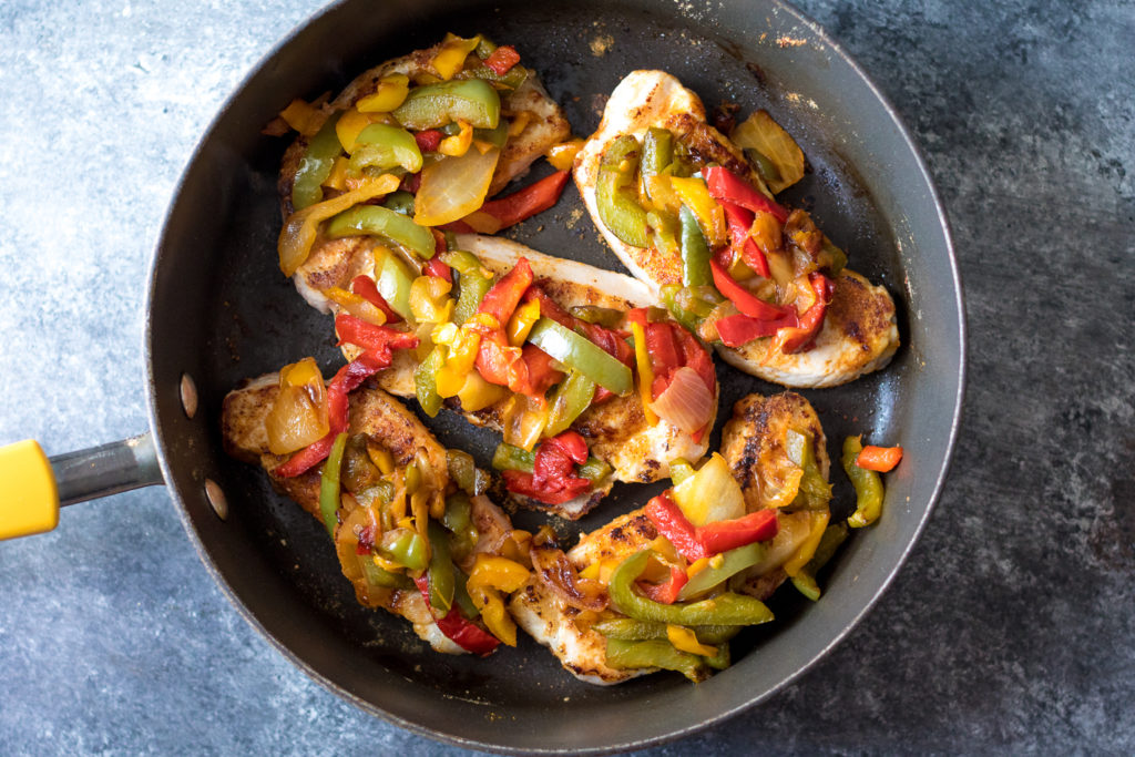 Fajita Topped Pork Chops are the quick and flavorful dinner you will want to make every week! So easy, cheesy and delicious!