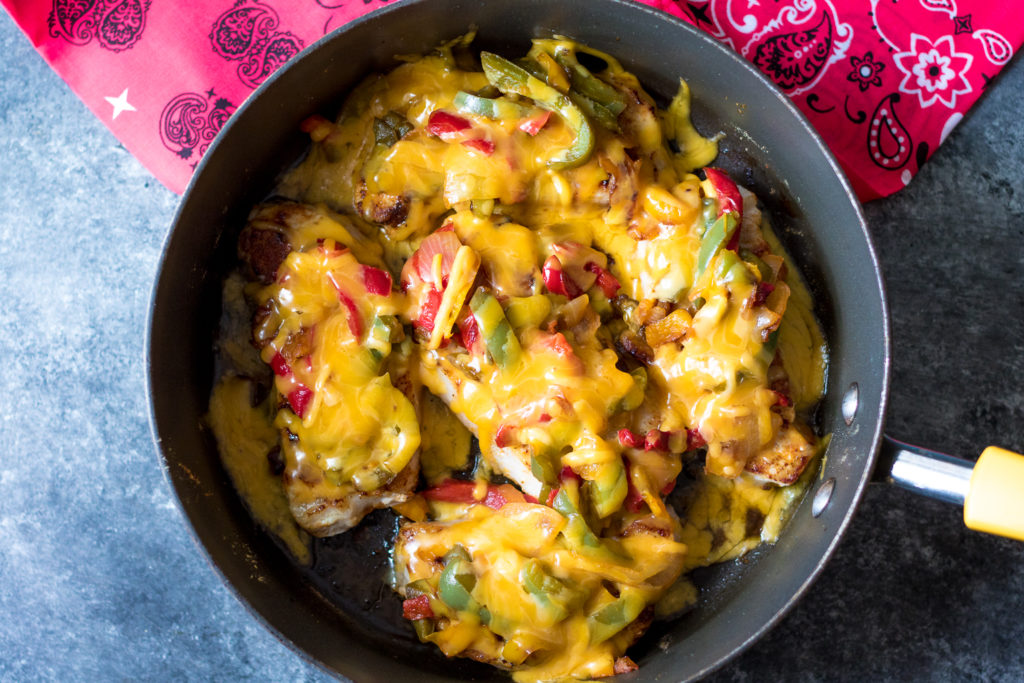 Fajita Topped Pork Chops are the quick and flavorful dinner you will want to make every week! So easy, cheesy and delicious!