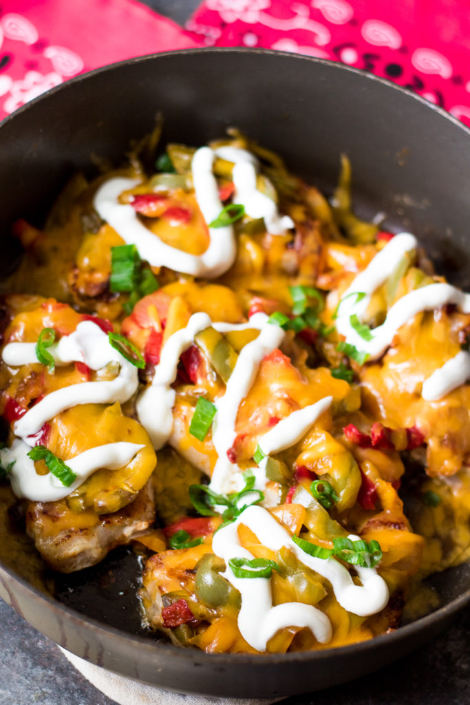 Fajita Topped Pork Chops are the quick and flavorful dinner you will want to make every week! So easy, cheesy and delicious!