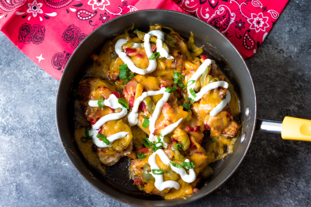 Fajita Topped Pork Chops are the quick and flavorful dinner you will want to make every week! So easy, cheesy and delicious!