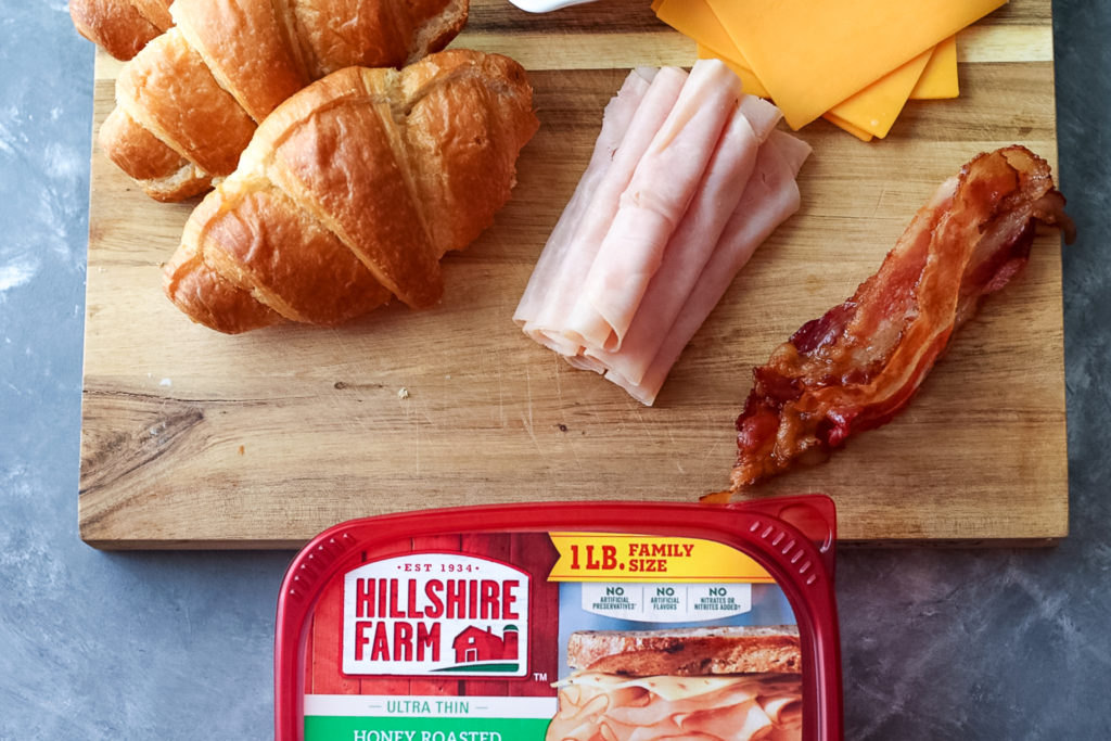 Turkey Bacon Ranch Melts are your new favorite sandwich!! Melty cheese, crispy bacon, turkey and ranch all warm and tucked into a buttery croissant.