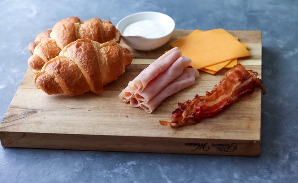 Turkey Bacon Ranch Melts are your new favorite sandwich!! Melty cheese, crispy bacon, turkey and ranch all warm and tucked into a buttery croissant.