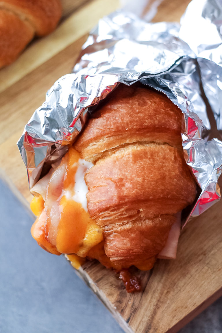 Turkey Bacon Ranch Melts are your new favorite sandwich!! Melty cheese, crispy bacon, turkey and ranch all warm and tucked into a buttery croissant.