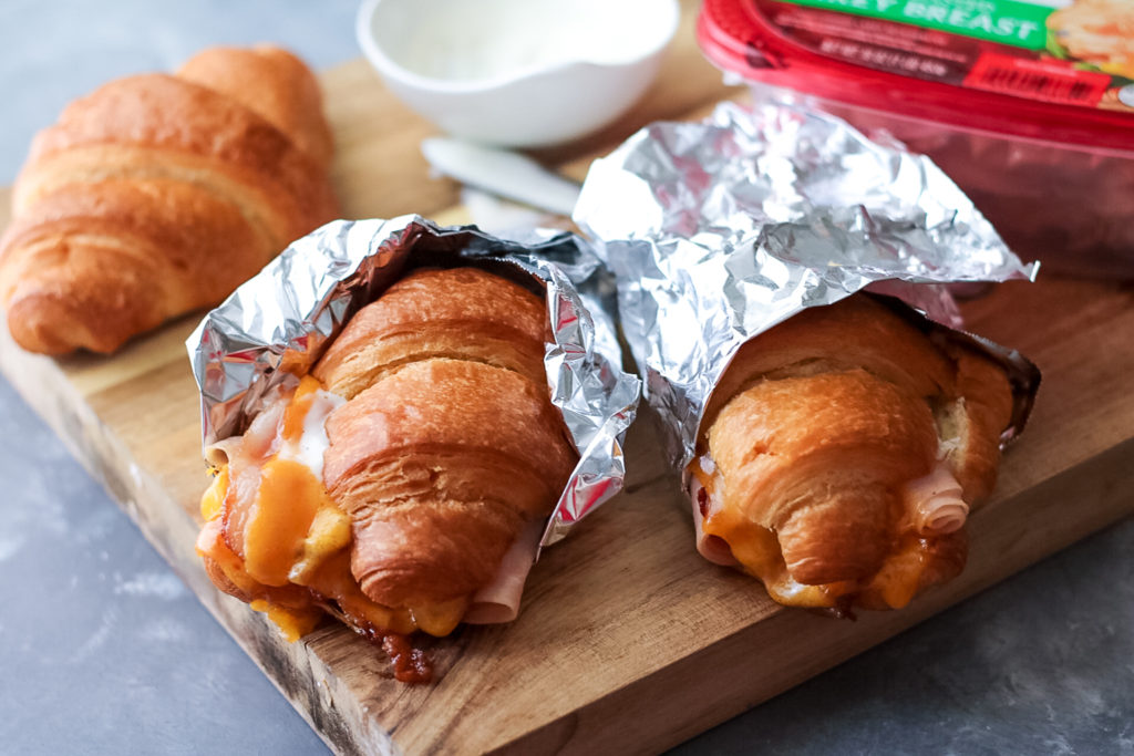 Turkey Bacon Ranch Melts are your new favorite sandwich!! Melty cheese, crispy bacon, turkey and ranch all warm and tucked into a buttery croissant.