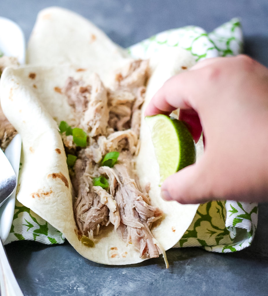 Slow Cooker Green Chile Pork is the 5 ingredient dinner that is ready when you are! You can use it in so many ways, like tacos!