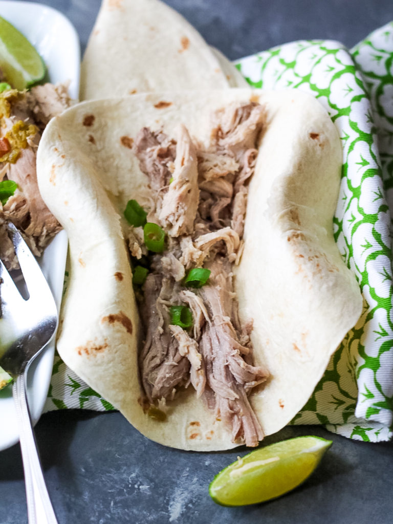 Slow Cooker Green Chile Pork is the 5 ingredient dinner that is ready when you are! You can use it in so many ways, like tacos!