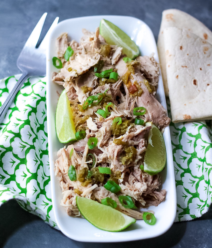 Slow Cooker Green Chile Pork is the 5 ingredient dinner that is ready when you are! You can use it in so many ways, like tacos!