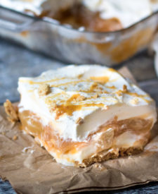 No Bake Caramel Apple Lush is perfect Fall with layers of cream cheese, whipped cream, caramel, butterscotch pudding and apple pie filling.