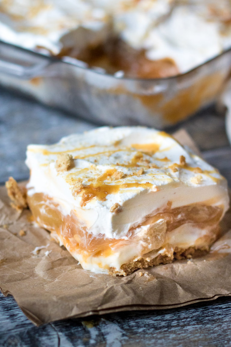 No Bake Caramel Apple Lush is perfect Fall with layers of cream cheese, whipped cream, caramel, butterscotch pudding and apple pie filling.