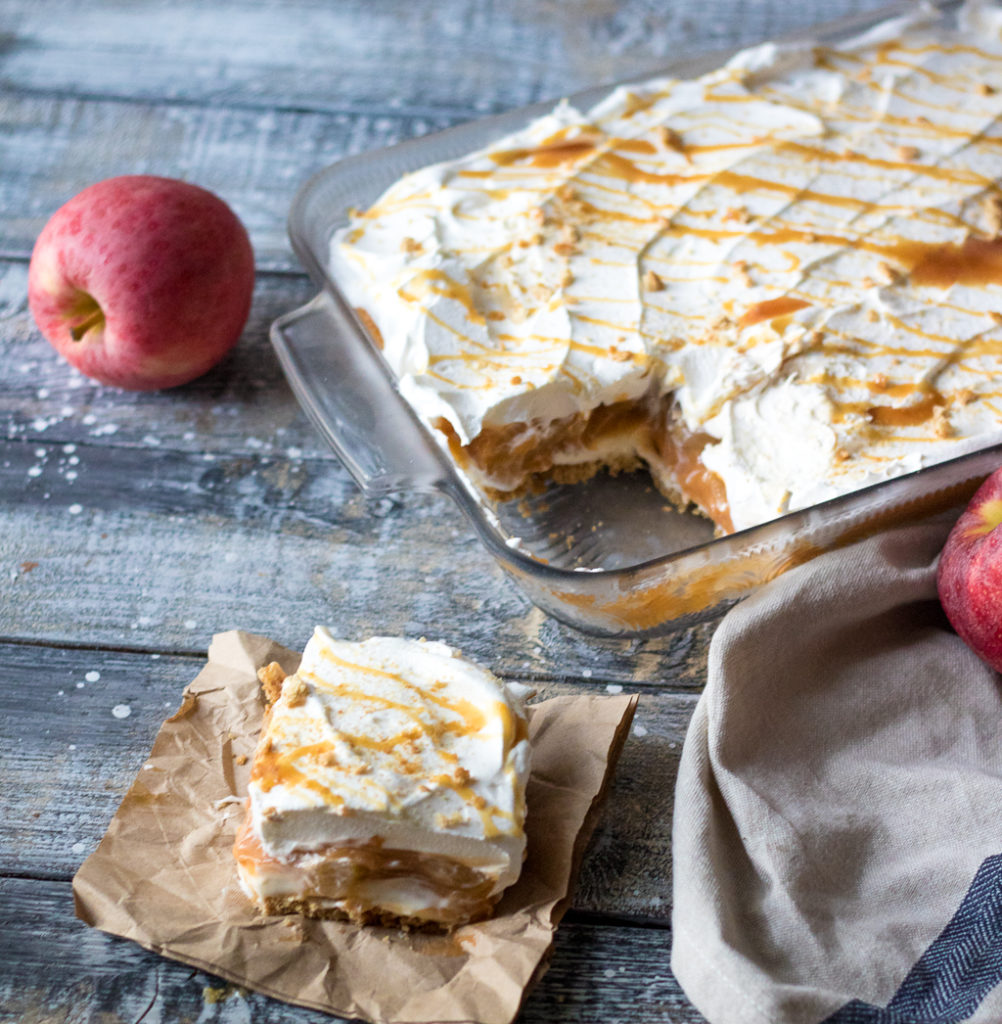 No Bake Caramel Apple Lush is perfect Fall with layers of cream cheese, whipped cream, caramel, butterscotch pudding and apple pie filling.