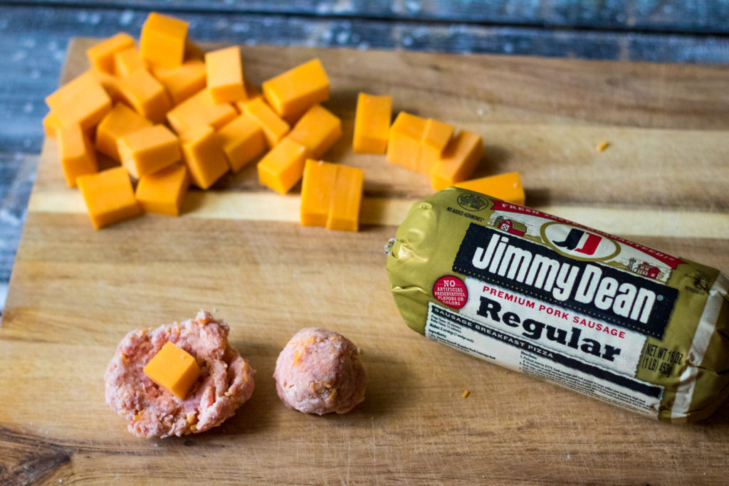 Sausage Ball Biscuit Bombs are stuffed with cheese and then baked in a biscuit bomb and topped with everything bagel seasoning to create the perfect bite!