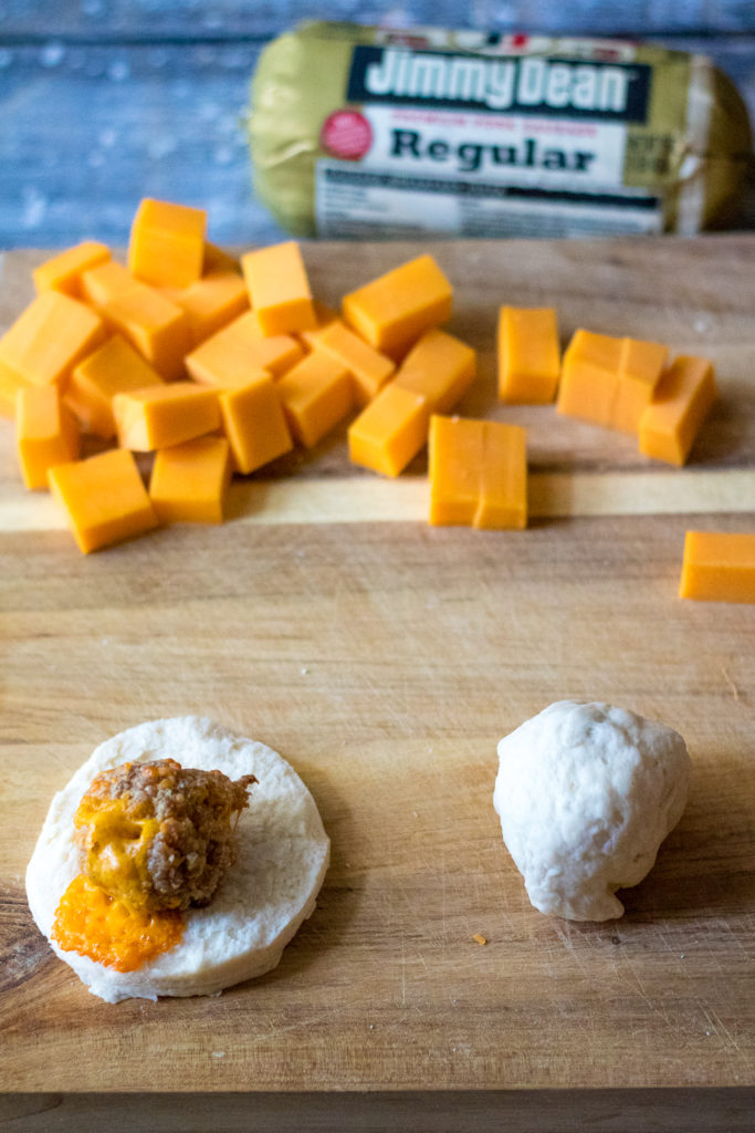 Sausage Ball Biscuit Bombs are stuffed with cheese and then baked in a biscuit bomb and topped with everything bagel seasoning to create the perfect bite!