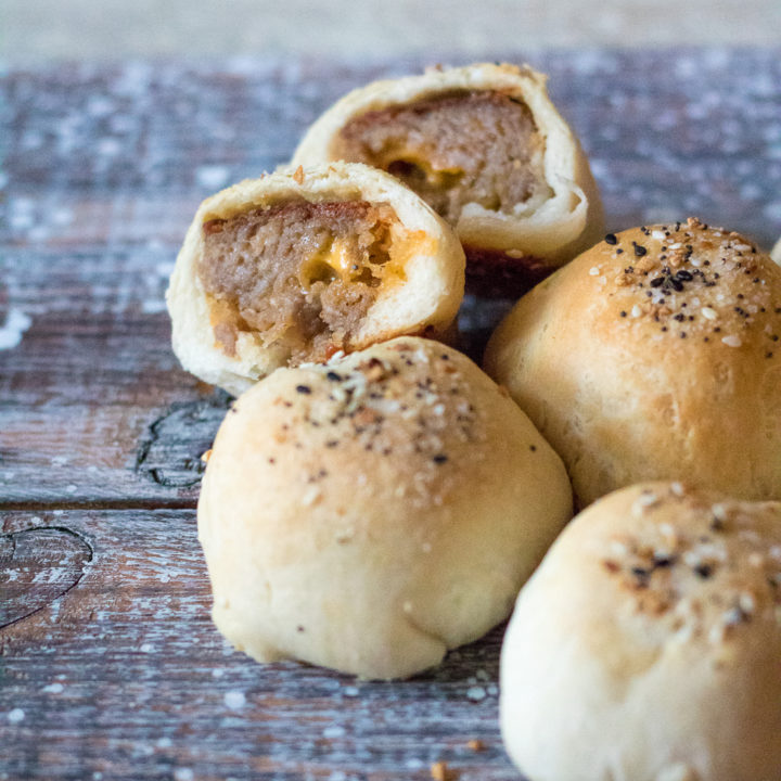 Sausage Ball Biscuit Bombs are stuffed with cheese and then baked in a biscuit bomb and topped with everything bagel seasoning to create the perfect bite!