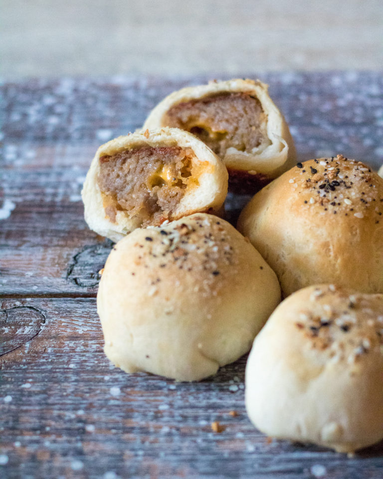 Sausage Ball Biscuit Bombs are stuffed with cheese and then baked in a biscuit bomb and topped with everything bagel seasoning to create the perfect bite!