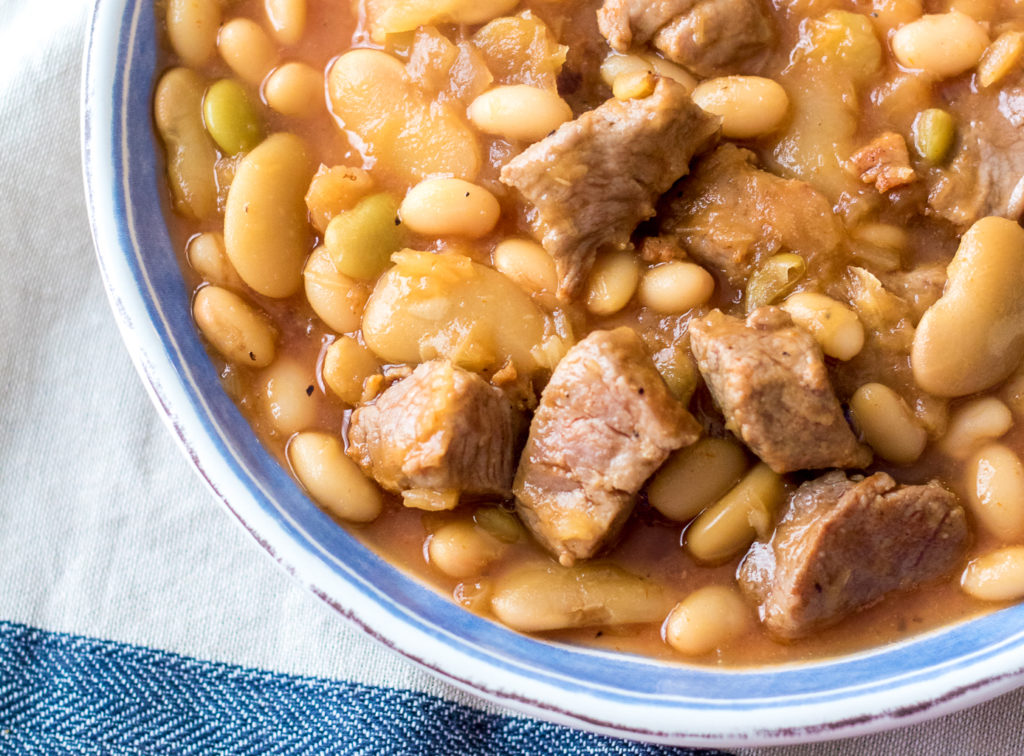 Cowboy Pork and Beansare so easy to make right in the slow cooker! Tender pork and a secret ingredient give this dish amazing flavor!