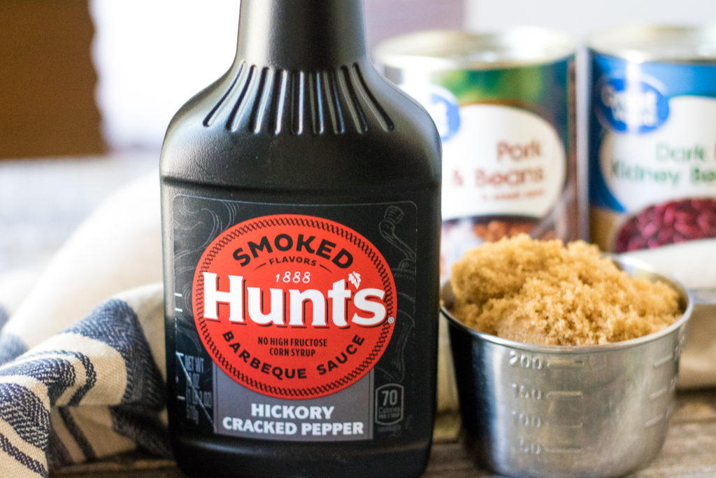 Slow Cooker Beefy Calico Beans are thick, rich and full of bacon and ground beef. Perfect for cookouts and a real crowd pleaser!