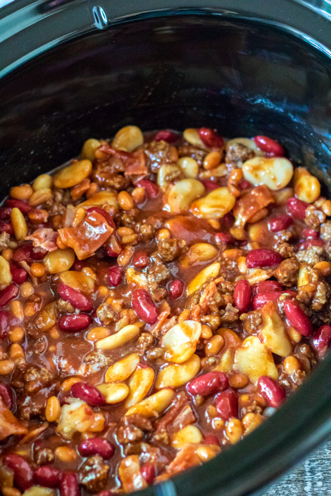 Slow Cooker Beefy Calico Beans are thick, rich and full of bacon and ground beef. Perfect for cookouts and a real crowd pleaser!