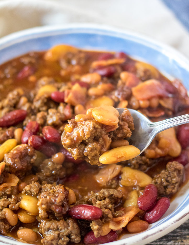 Slow Cooker Beefy Calico Beans are thick, rich and full of bacon and ground beef. Perfect for cookouts and a real crowd pleaser!