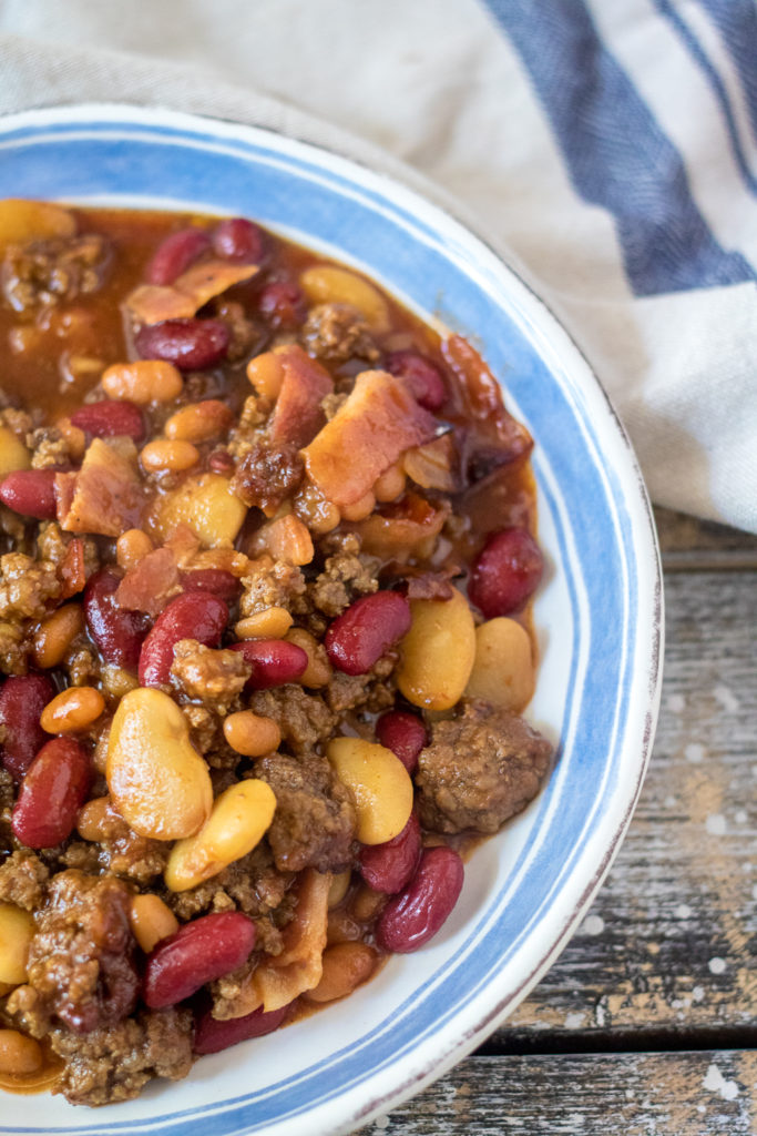Slow Cooker Beefy Calico Beans are thick, rich and full of bacon and ground beef. Perfect for cookouts and a real crowd pleaser!
