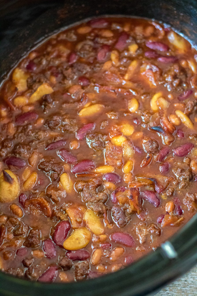 Slow Cooker Beefy Calico Beans are thick, rich and full of bacon and ground beef. Perfect for cookouts and a real crowd pleaser!
