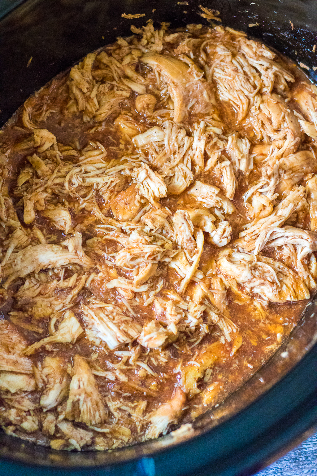 Slow Cooker Root Beer BBQ Sliders are the perfect dinner for summer! Flavorful slow cooked chicken piled on soft slider buns with a scoop of coleslaw, yum!