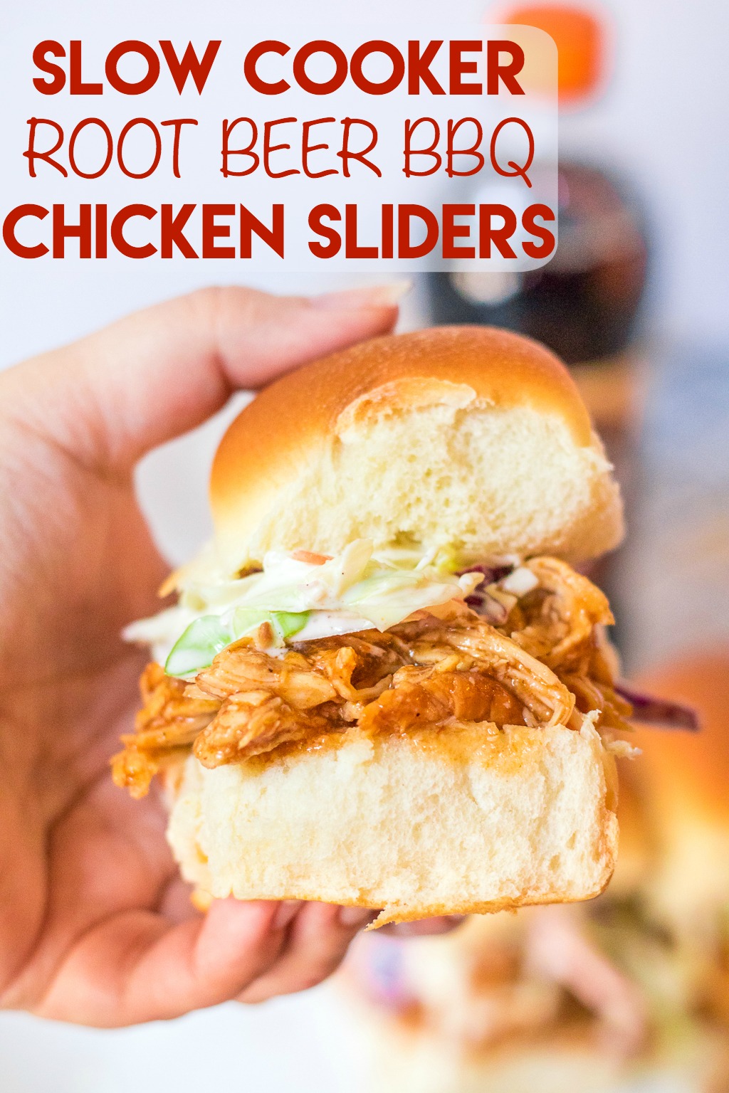 Slow Cooker Root Beer BBQ Sliders are the perfect dinner for summer! Flavorful slow cooked chicken piled on soft slider buns with a scoop of coleslaw, yum!