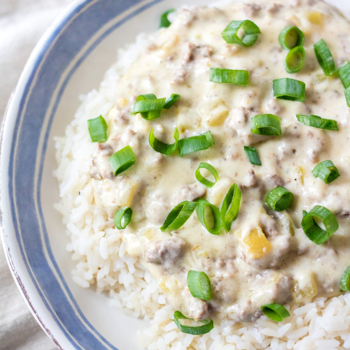 Cheesy Green Chile Beef & Rice is the perfect, easy, quick dinner that everyone will love! Full of flavor but not too spicy it is a crowd pleaser!