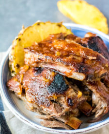 Slow Cooker Pineapple BBQ Ribs cook right in the slow cooker so no need to heat up the kitchen. Full of sweet pineapple flavor, these tender ribs are great!